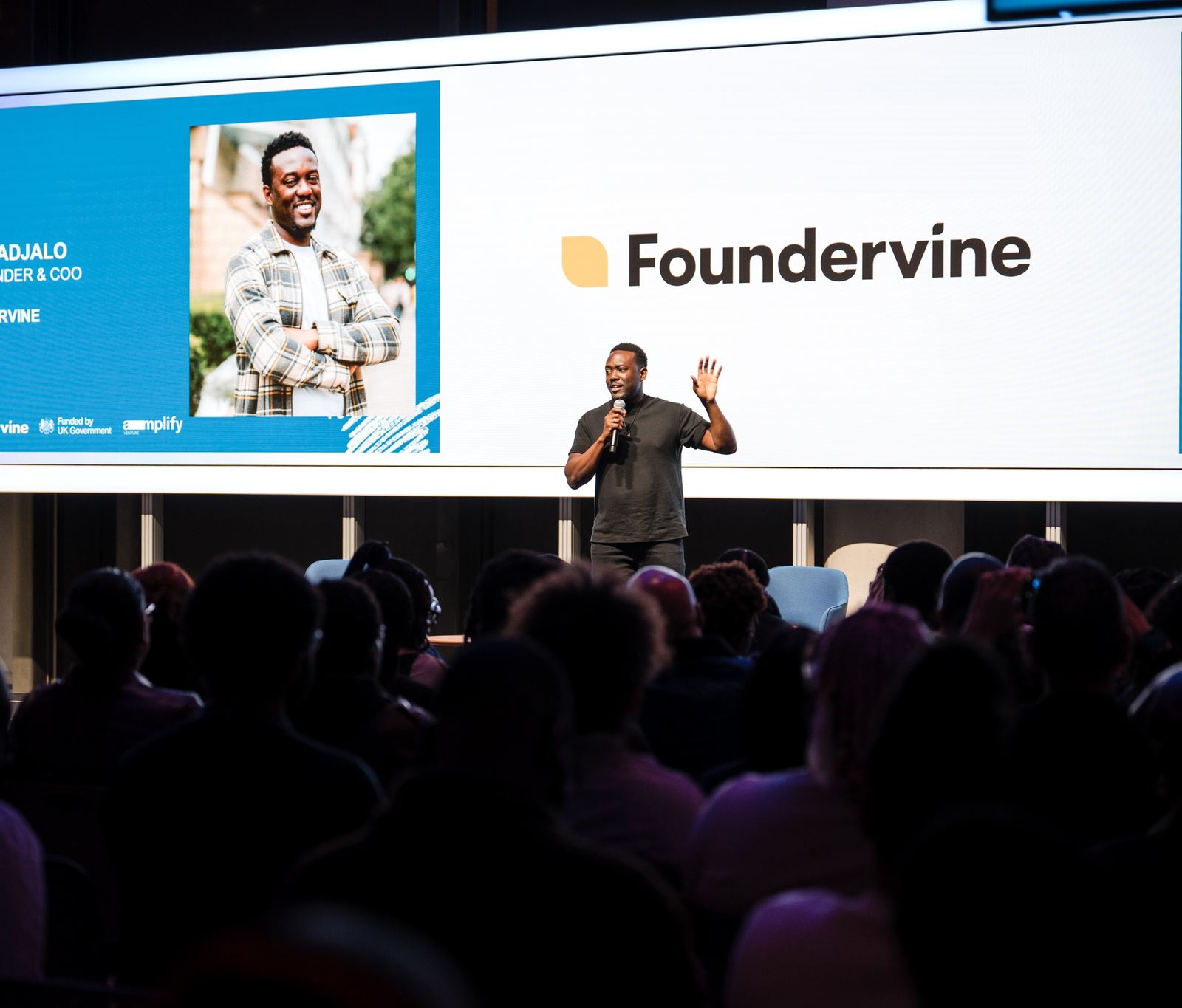 Cecil Adjalo speaking on stage to a full audience at Creative Founders Connect at Meta